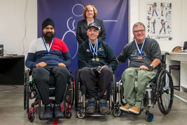 Kiranjit Singh, Michael Johnson and Grant Sharman with medals