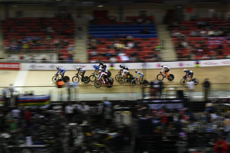 Blurred shot of a group of Para cyclists racing in a Velodrome