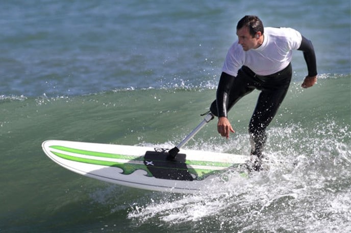 Paralympian Chris Adamson surfing with his special prosthetic leg