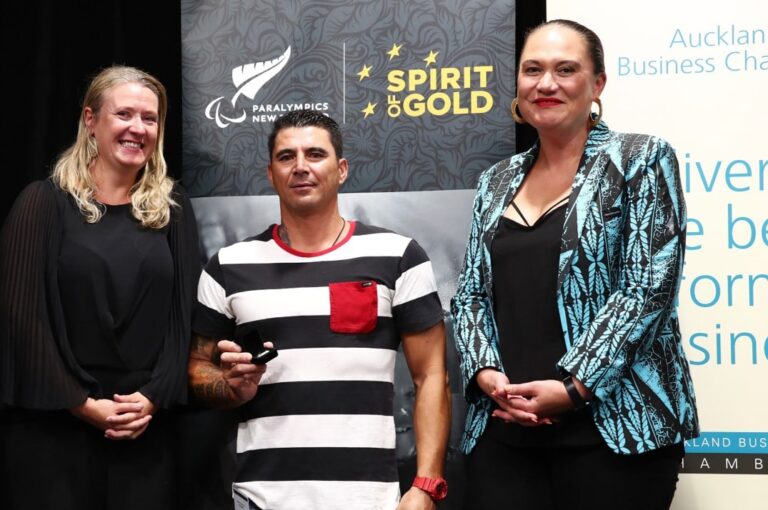 Reweti receives his paralympic pin with Minister of Disability Issues and PNZ Chief executive