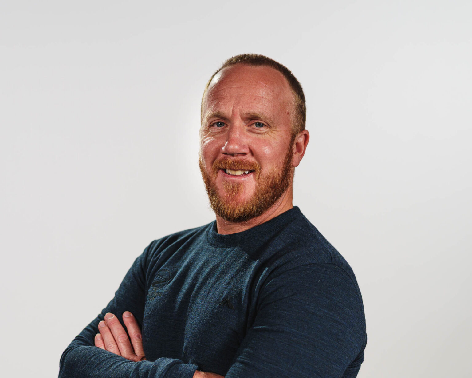 A portrait of Corey Peters on a white background.