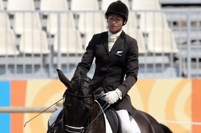 Jayne Craike, New Zealand Paralympian rides horse in stadium