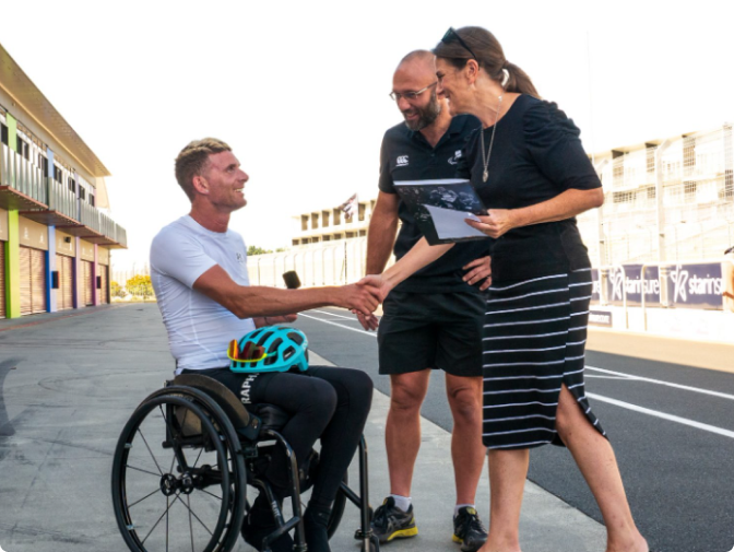 A paralympian shook his hand to a PNZ staff