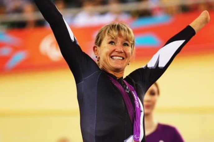 Fiona Southorn, New Zealand Paralympian celebrating on podium