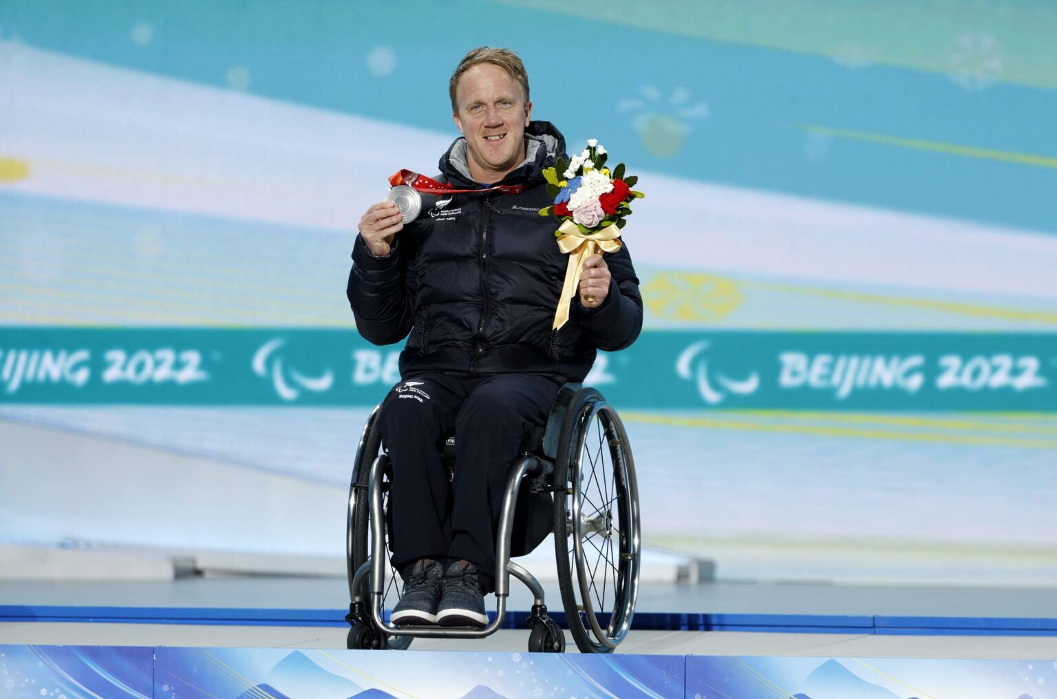 Corey Peters on podium in Beijing 2022