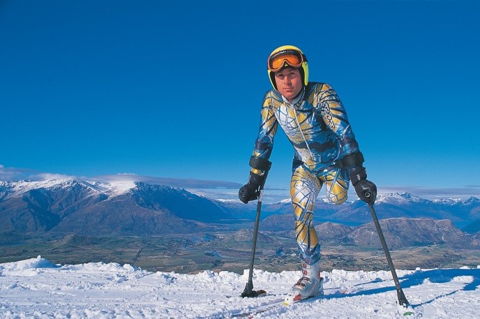Kevin Aleksich, New Zealand Paralympian on skis on top of mountain