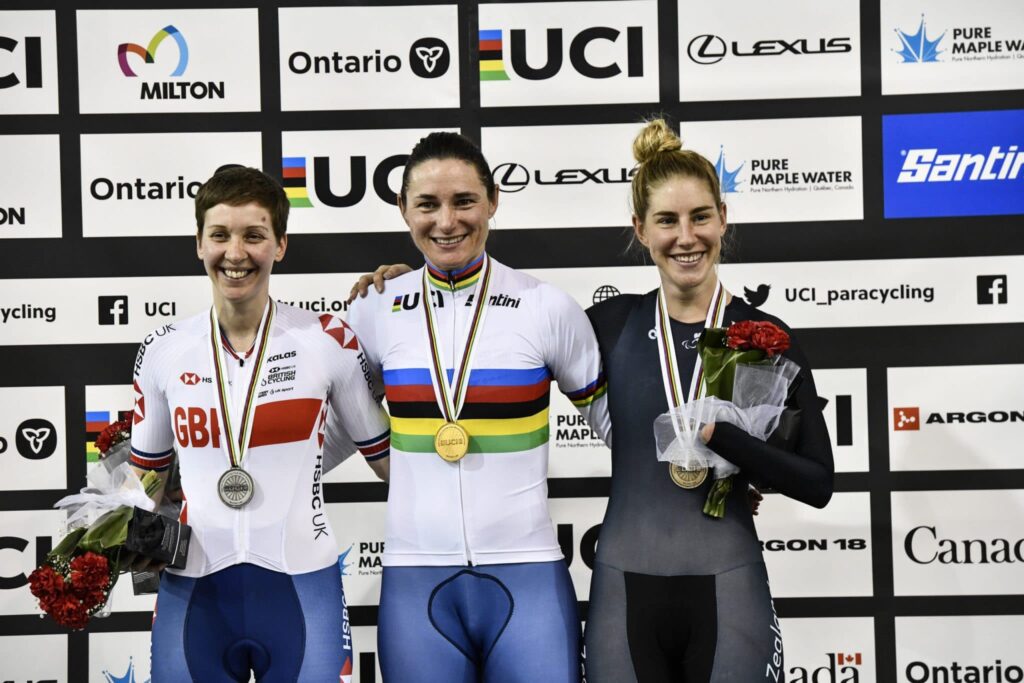 Nicole Murray with bronze medal posing next to silver and gold medallists
