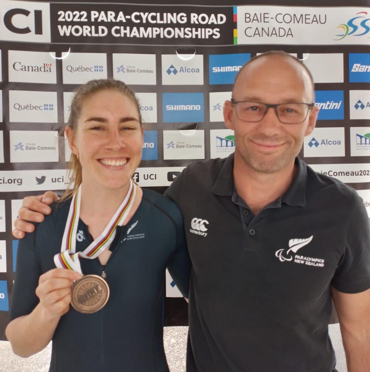 Nicole Murray holds bronze medal, pictured with coach Damian Wiseman