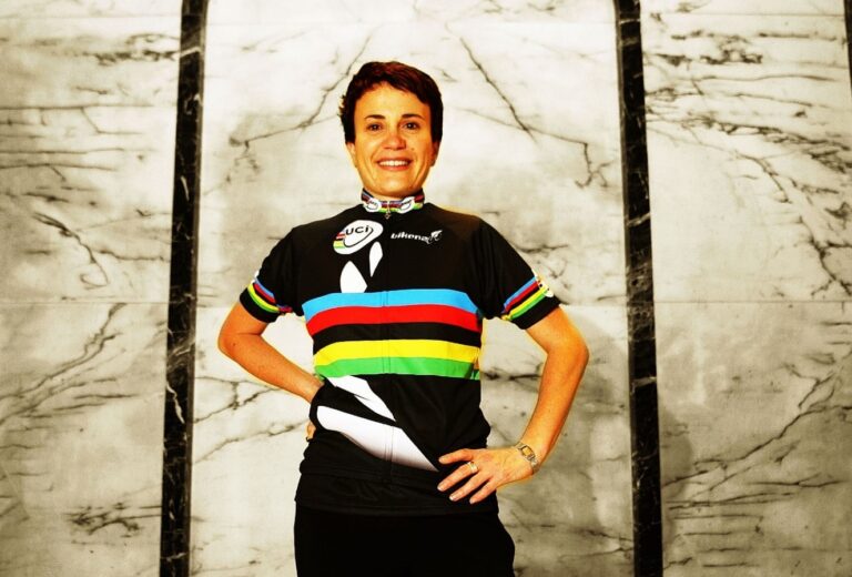 Paula Tesoriero standing and wearing her Para cycling World Champs jersey