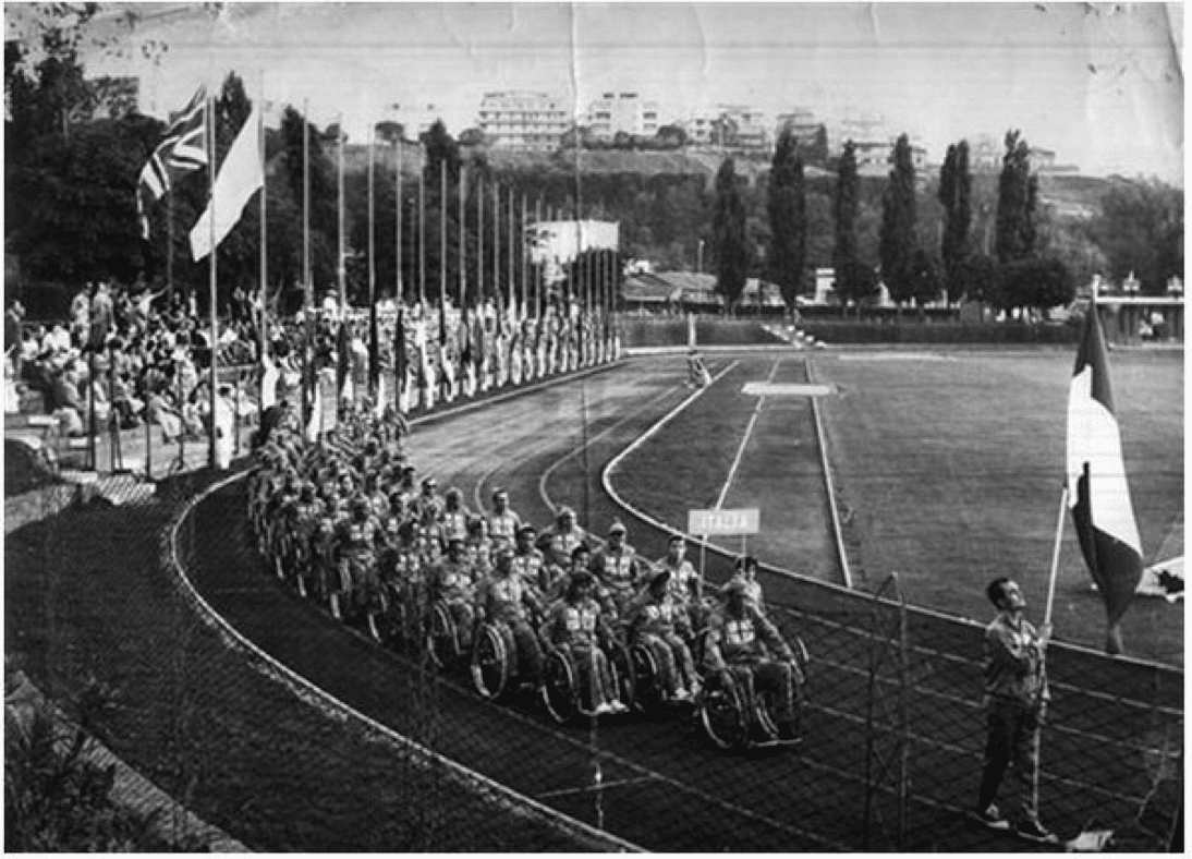 Opening ceremony with athletes in wheelchair parading on the athletic track in Rome in 1960