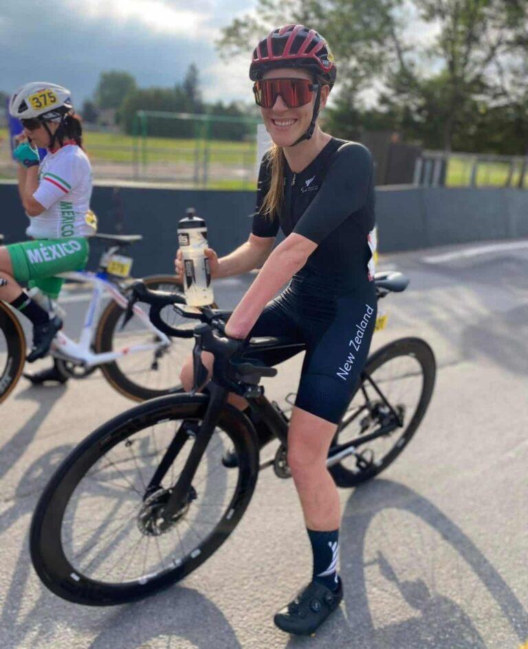 Nicole Murray on bike with water bottle, smiling
