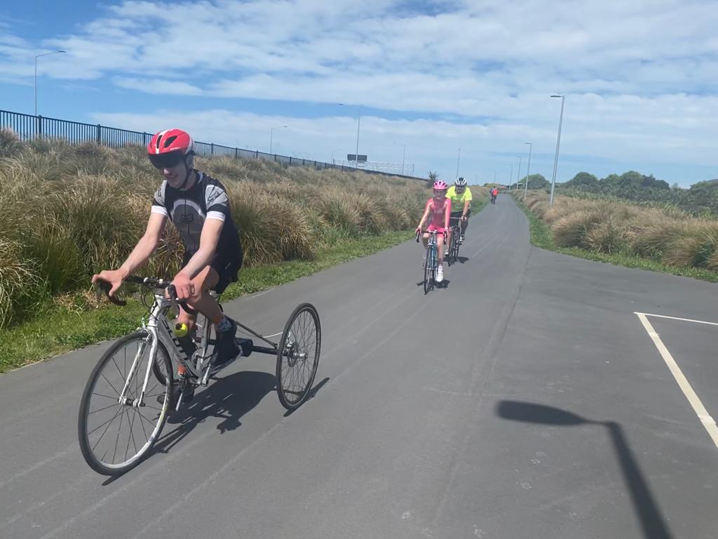 Jordon Milroy, Charlotte Walker and coach Kerry Reyburn on the Christchurch cycle way