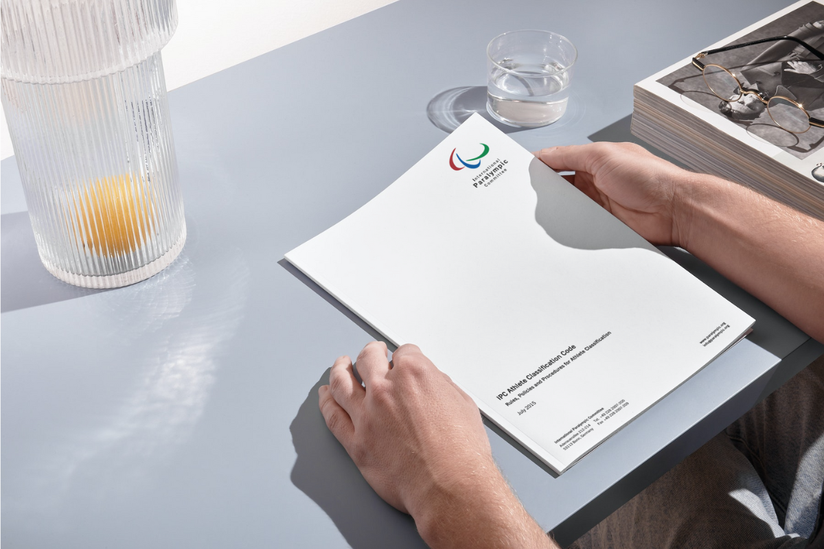 A mockup image of an IPC Classification document on a desk.