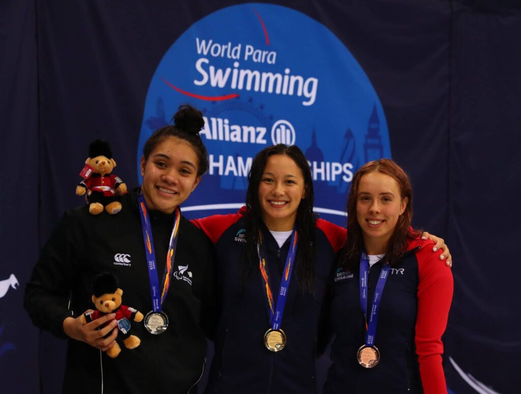 Tupou Neiufi of New Zealand (silver) Alice Tai (gold) and Megan Richter (bronze) of Great Britain with their medals after the 100m Backstroke S8 Final