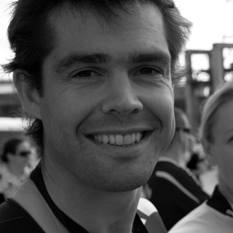 Nathan smiling post-race in 2011, black and white