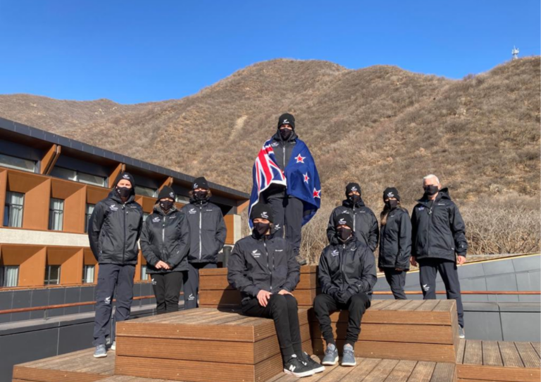 Entire NZ Paralympic Team at Paralympic Village, group photo in front of mountain backdrop