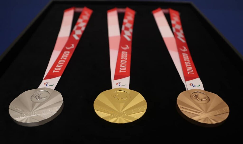 Silver, Gold and Bronze medals on black fabric