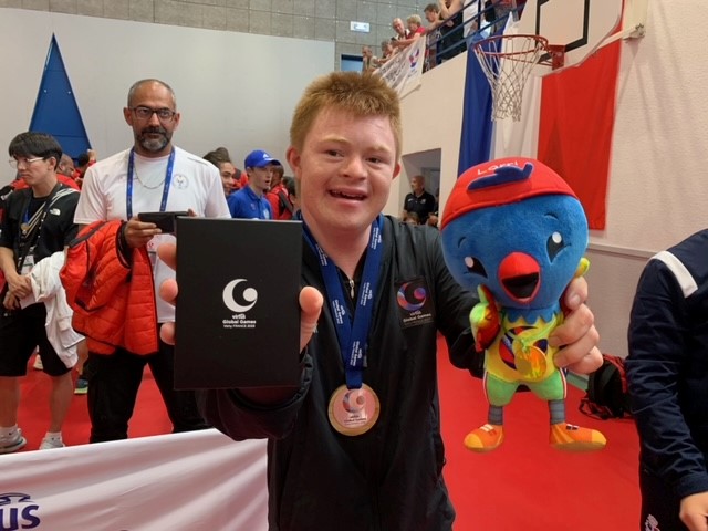 Alfie with his silver medal and mascot