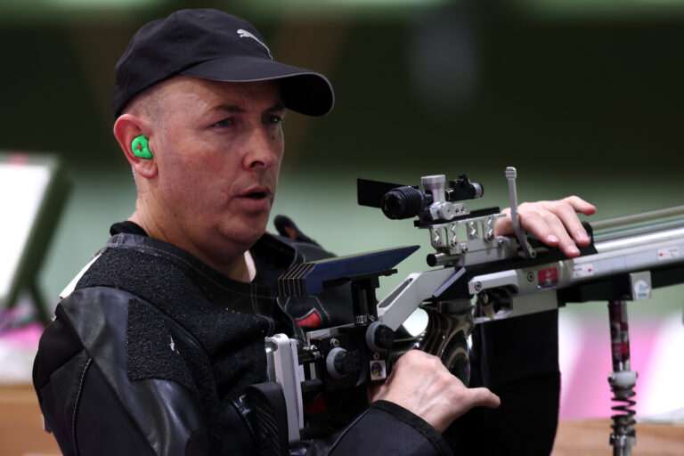 Paralympian 148 Michael Johnson holds his rifle as he competes in Shooting Para Sport at the Tokyo 2020 Paralympic Games