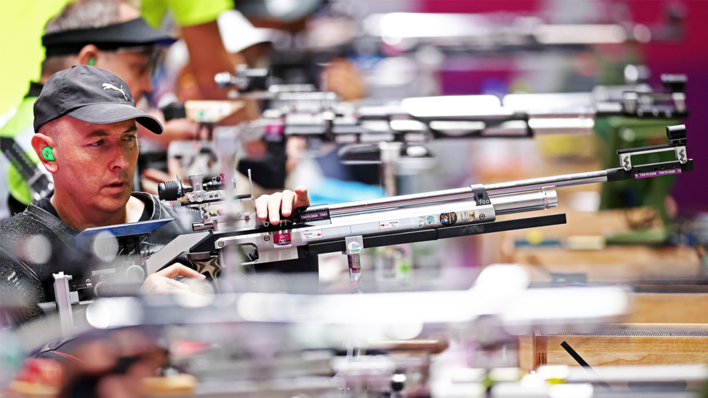 Michael Johnson prepares to shoot in competition for Shooting Para sport