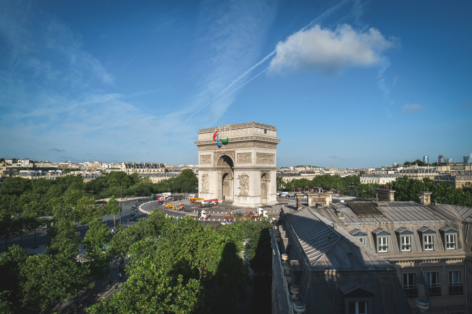 The Arc de Triomphe stands tall in Paris adorned with the Agitos, the symbol of the Paralympic Games.