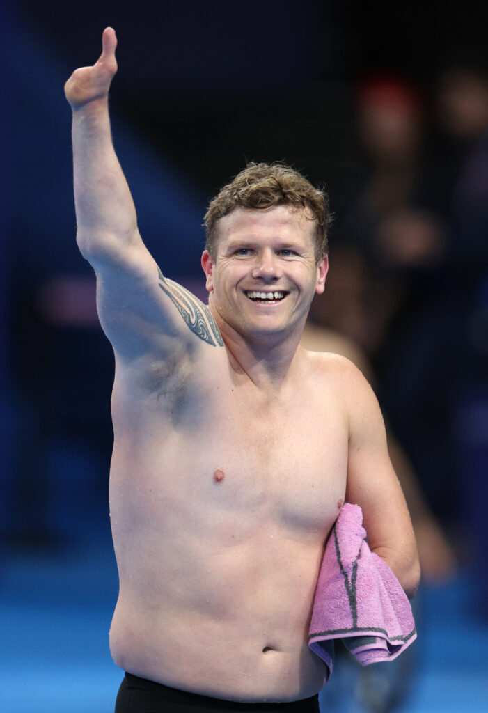 Cameron Leslie waves to the crowd following the Men's 50m Backstroke S4 Final in which he placed fourth.