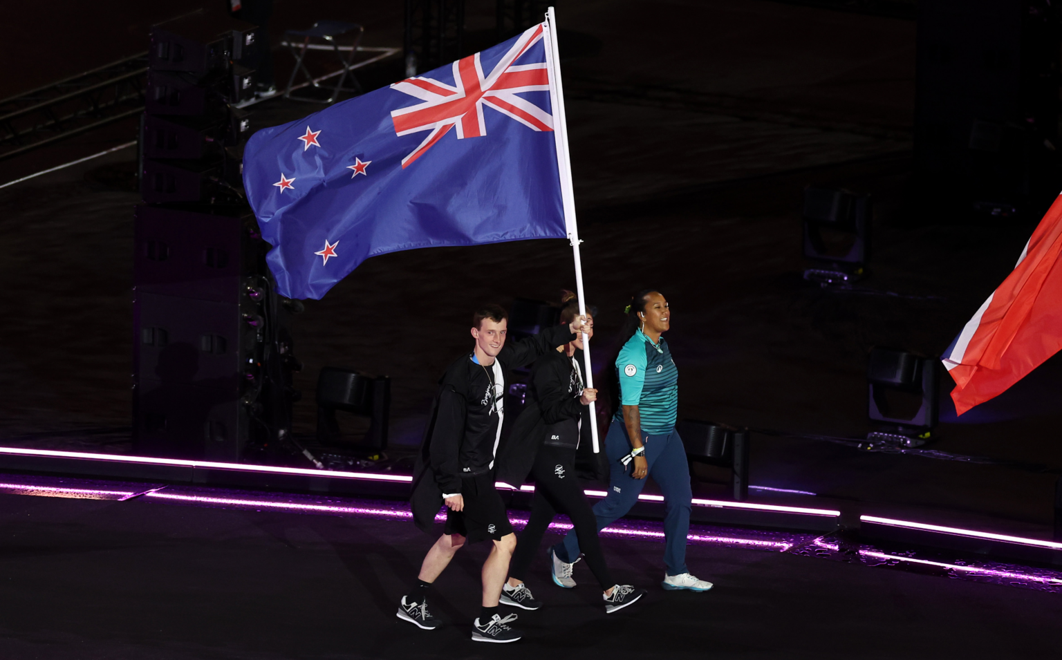 William Stedman and Nicole Murray carry the New Zealand flag at the Closing Ceremony of the Paris 2024 Paralympic Games