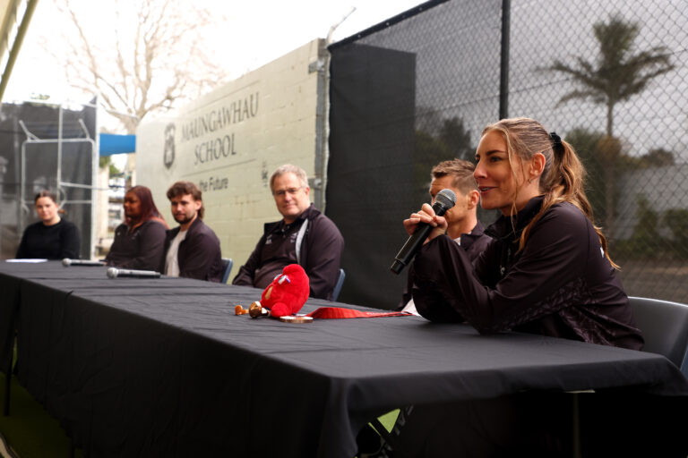 Nicole Murray speaks on a panel of NZ Paralympians to a school of children as they are welcomed home to New Zealand following Paris 2024.