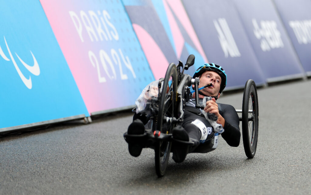 Image of handcyclist Rory Mead in race mode at Paris 2024