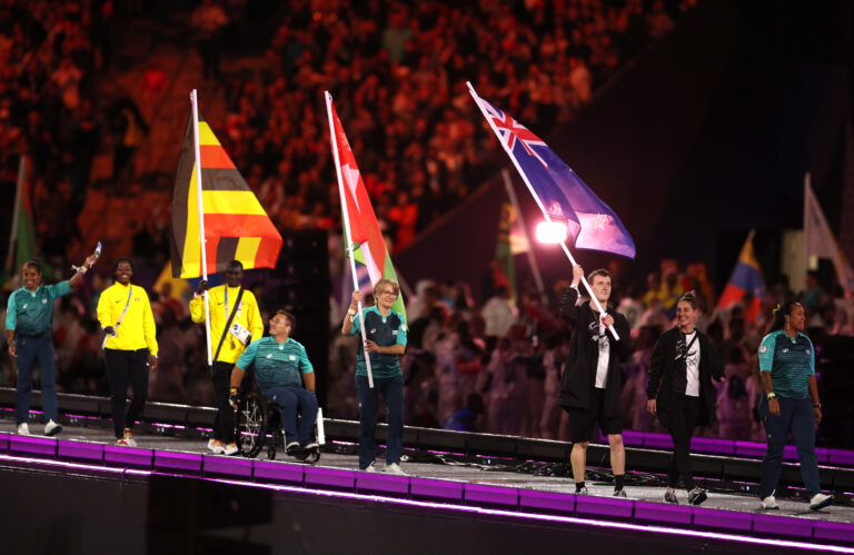 Nicole Murray and William Stedman, Flag Bearers of Team New Zealand, hold their national flags as they parade during the closing ceremony on day eleven of the Paris 2024 Paralympic Games at Stade de France on September 08, 2024 in Paris, France. (Credit Getty Images)