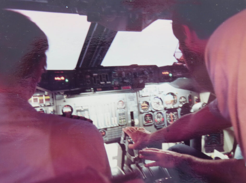 Chris Orr handles the throttle of the airplane en route to Innsbruck.