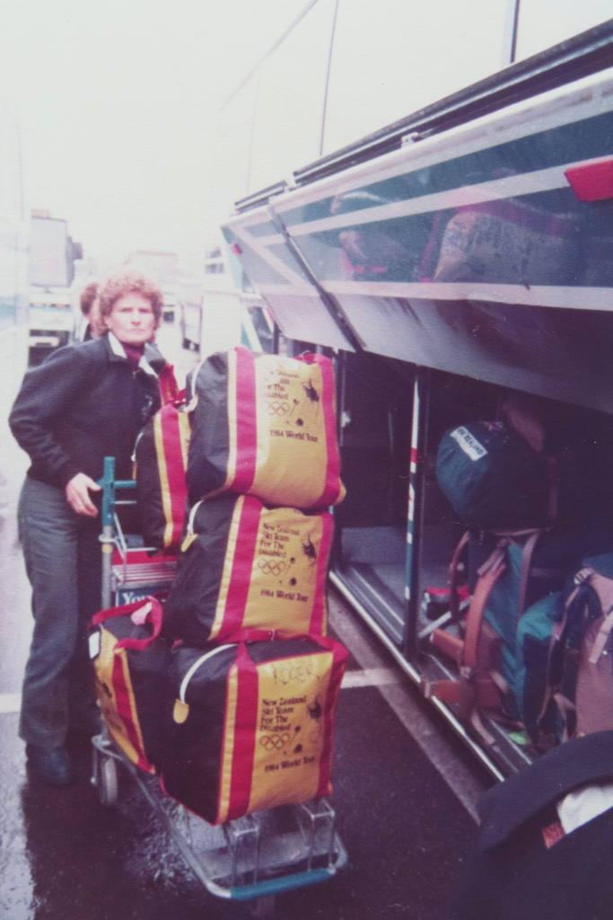 Lorraine Philip loads bags into a travel coach for the NZ Team at the 1984 Innsbruck Paralympic Games.