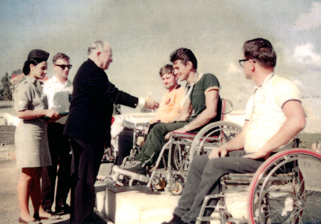 Founder of the Paralympic movement, Sir Ludwig Guttmann presents Australian Paralympian Tony South a gold medal for the Men's Albion Round open event at the 1968 Paralympic Games in Tel Aviv.