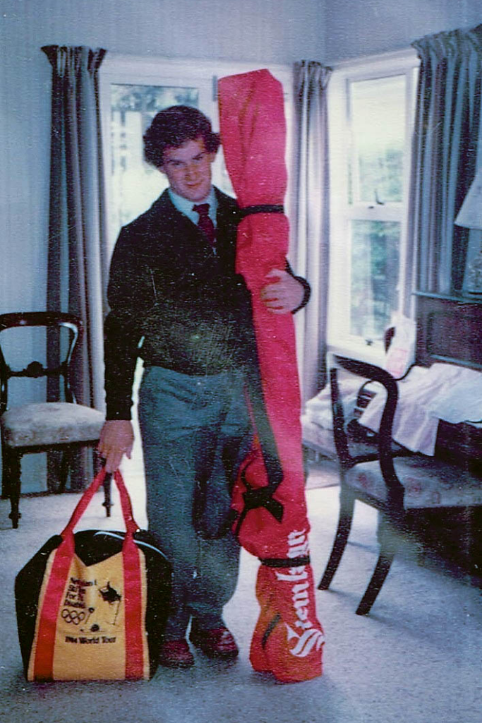 Mark Edwards holds ski bag and travel bag ahead of the 1984 Innsbruck Paralympic Games.