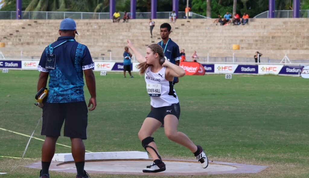 Para athlete Charli Gardiner-Hall throws a shot put 