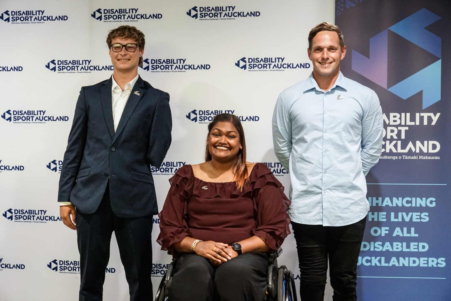 Three Paralympians recieved their numbered pin. Left to right stands Joshua Willmer, Neelam O'Neill and Mitchell Joynt