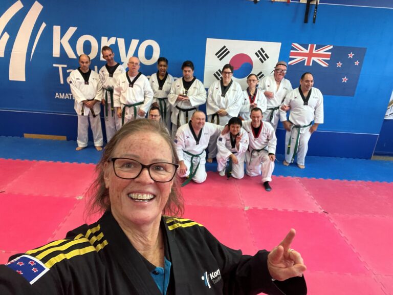 Para Taekwondo coach Camille Pruckmuller takes a selfie with her Para athletes in her dojang.