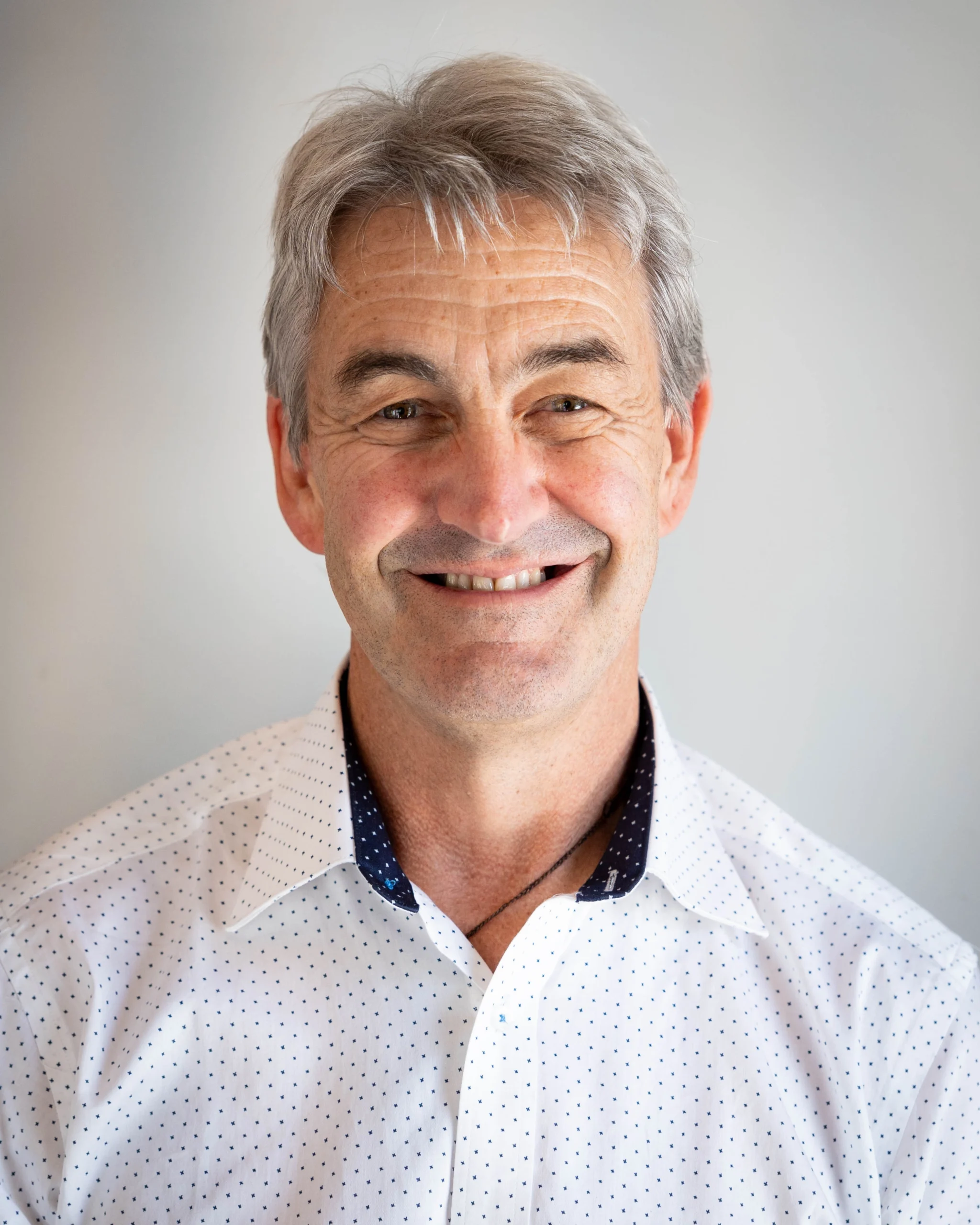 A professional portrait of Blair Gilbert on a white background.