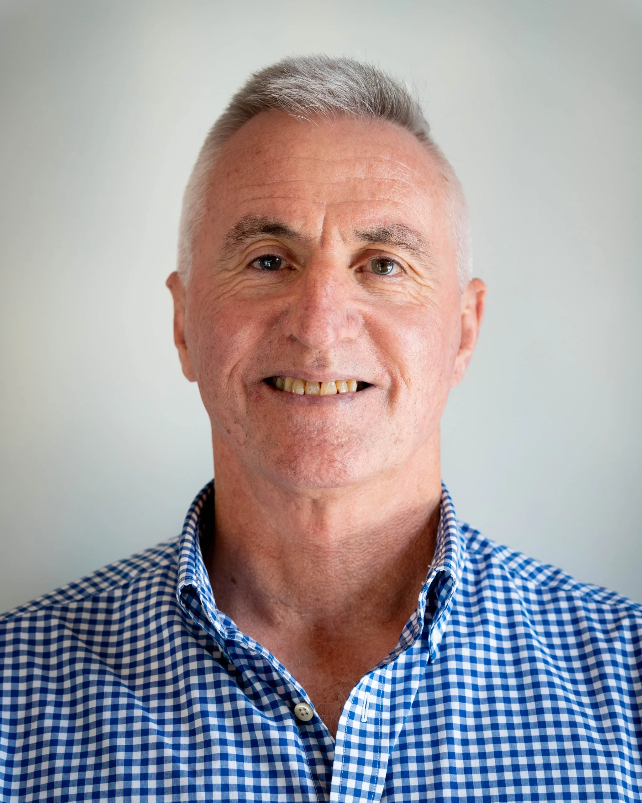 A professional portrait of Mike Bishop on a white background.