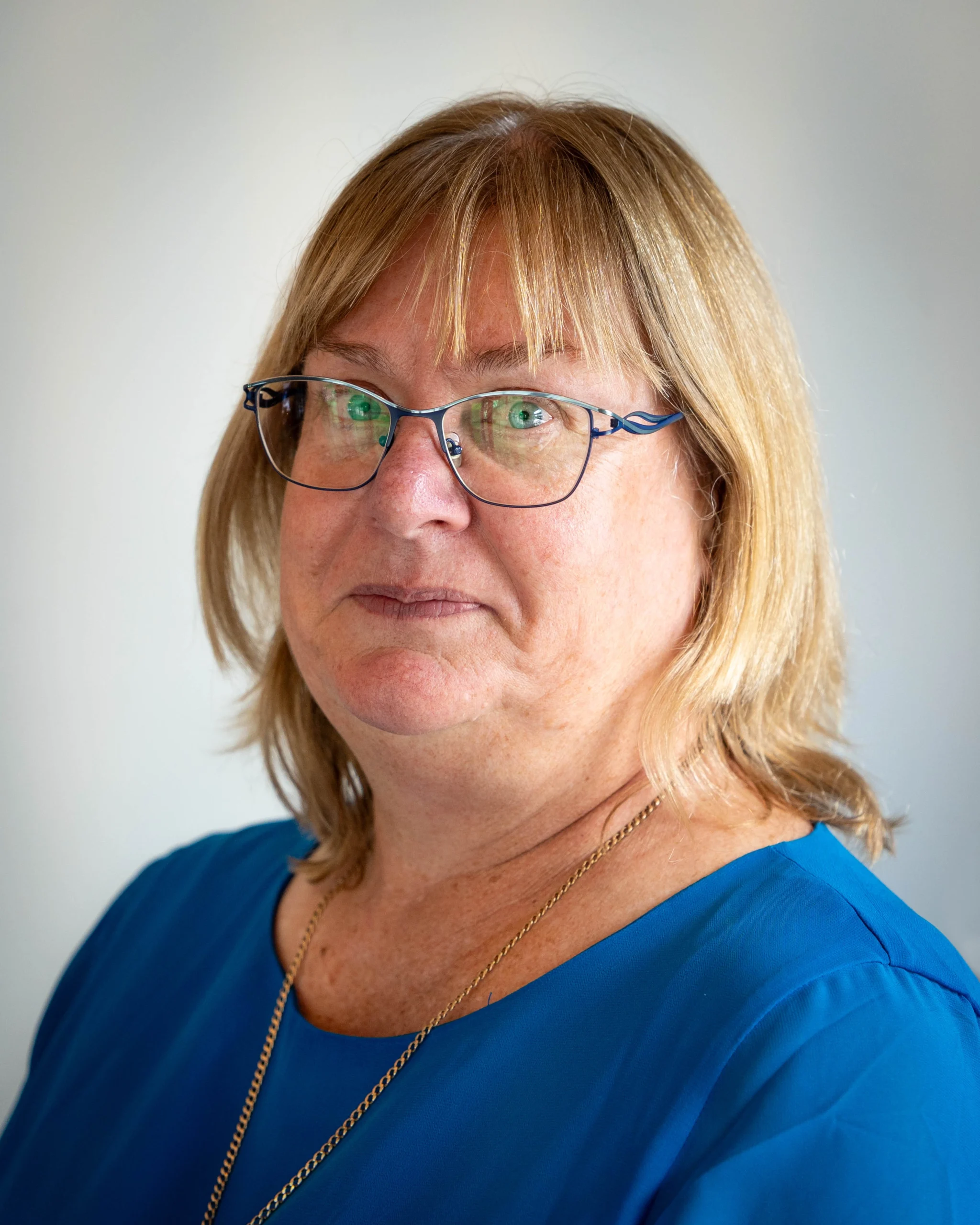 A professional portrait of Sian Ruth on a white background.