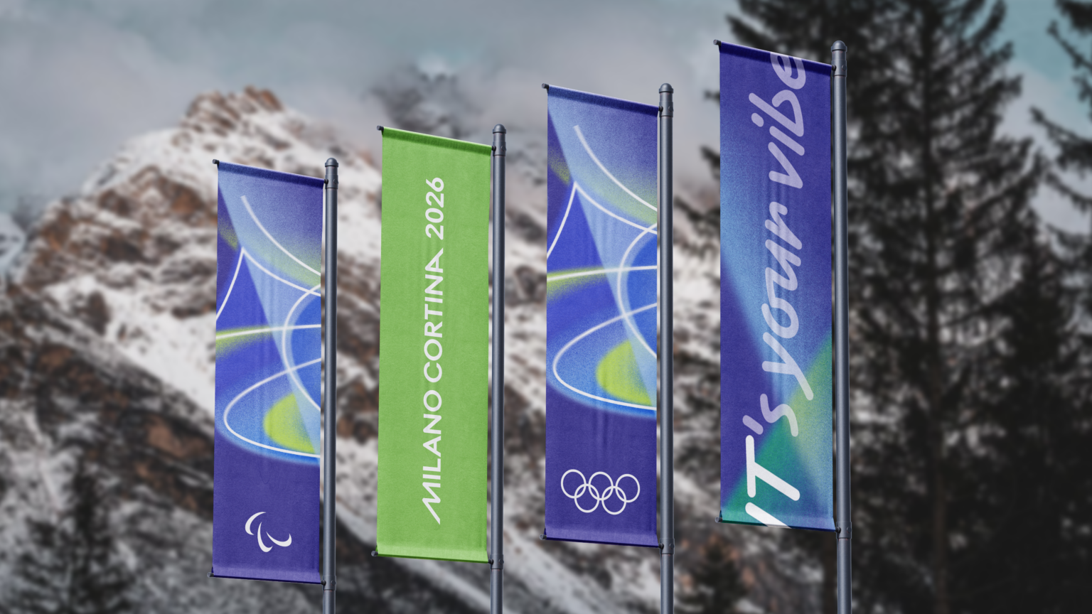 Colourful purple and green promotional banners for Milano Cortina hang from flag poles at the foot of a snowy mountain. Alpine trees surround.