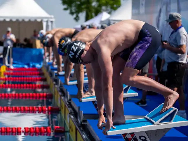 A Para swimmer with an intellectual impairment competes in a Virtus swimming competition.