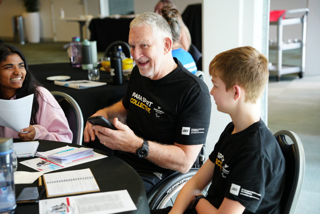 John Marrable in conversation with fellow members of the Para Sport Collective.