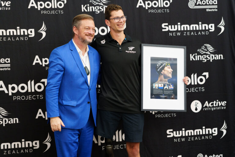 Jesse Reynolds is presented with a commemorative frame to mark his retirement from Para swimming by IPC President Andrew Parsons.