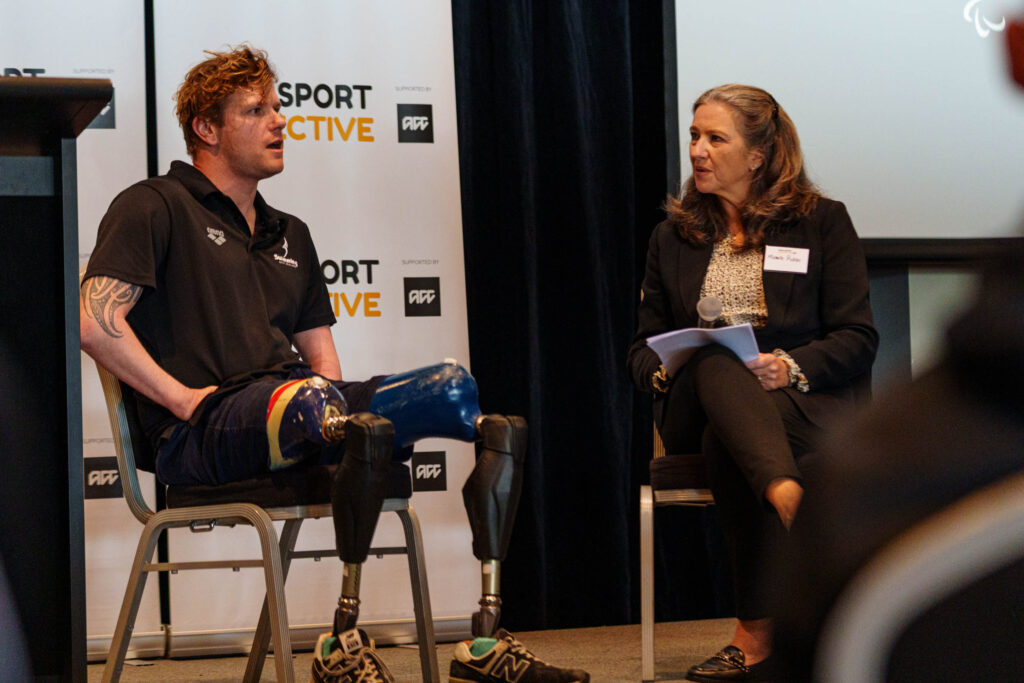 Cameron Leslie MNZM speaks with Michelle Pickles at the Para Sport Collective Hui hosted by Paralympics New Zealand on 25 August 2025.