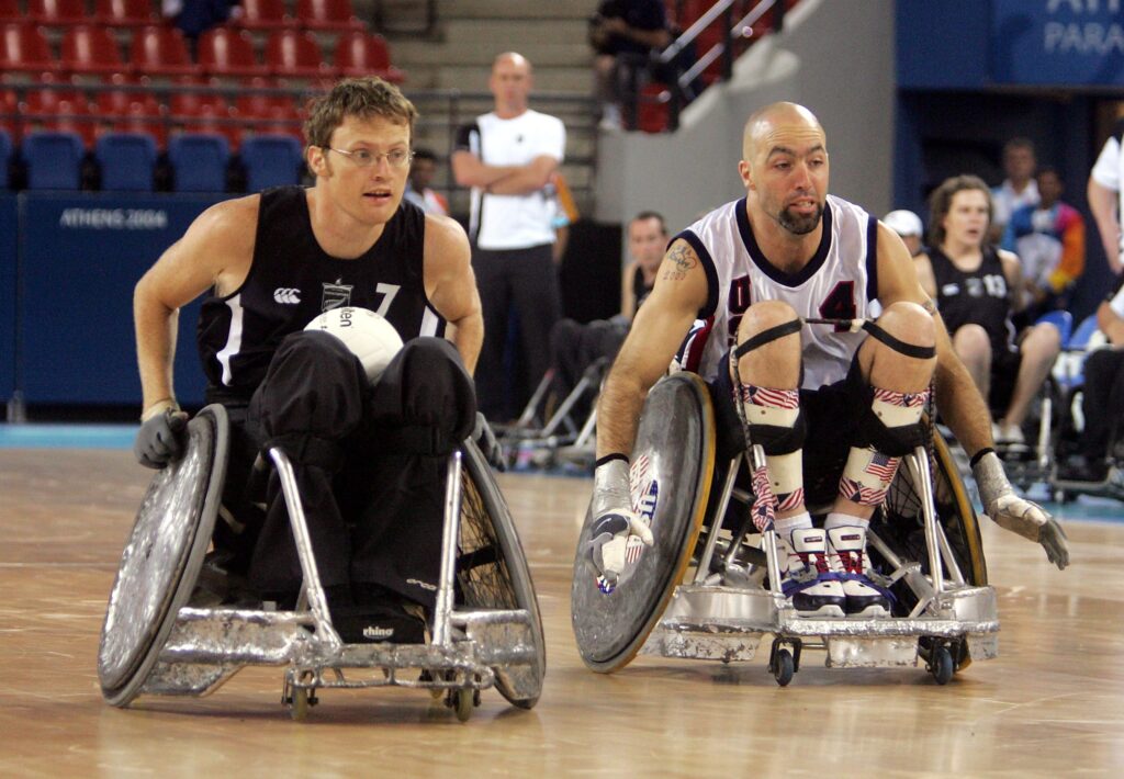 Tim Johnson holds the ball as he competes in Wheelchair Rugby at Athens 2004. 