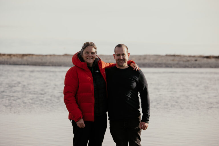 Jane Stevens stands with Paralympian #158 Adam Hall.