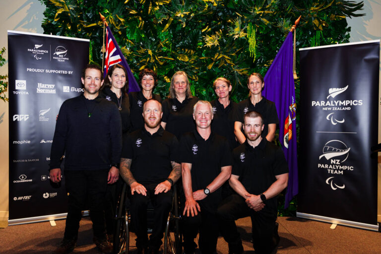 The NZ Paralympic Team pose for a photo on the stage at the Team Farewell event.