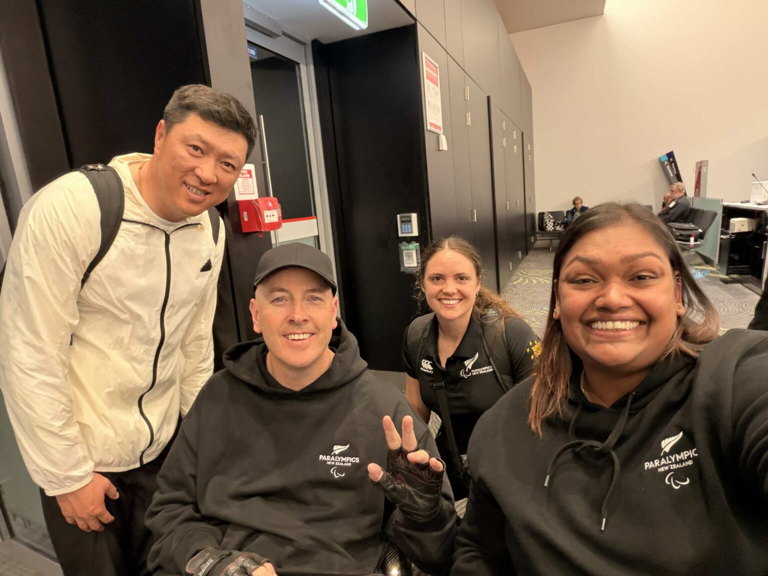 Neelam O'Neill takes a selfie with Michael Johnson and support team in the airport.