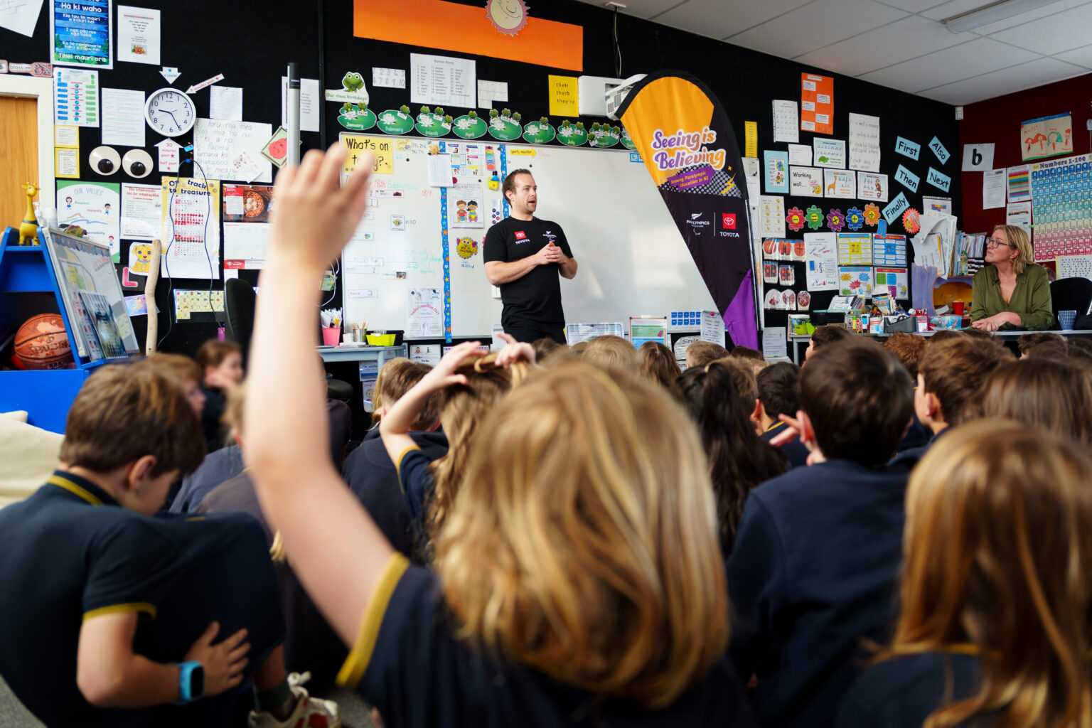Paralympian #158 Adam Hall speaks to a class of school children.